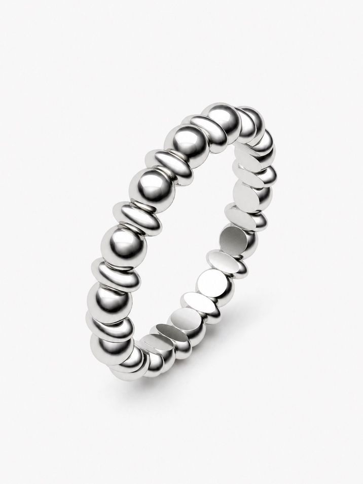 A minimalist gold ring featuring delicate beads and ovals