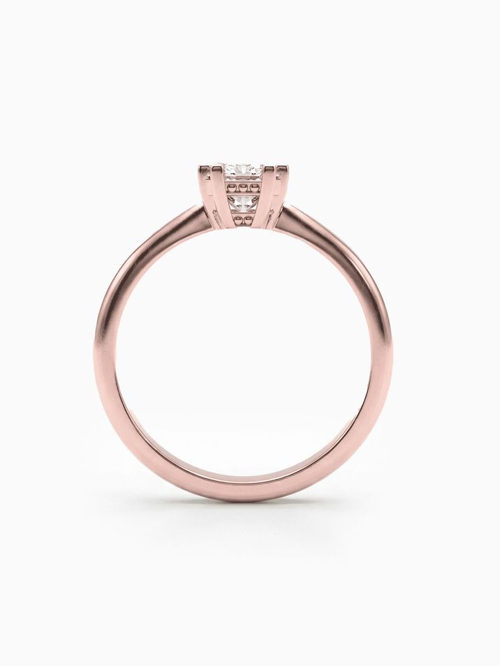Elegant rose gold engagement ring with a square princess-cut stone and a smooth band