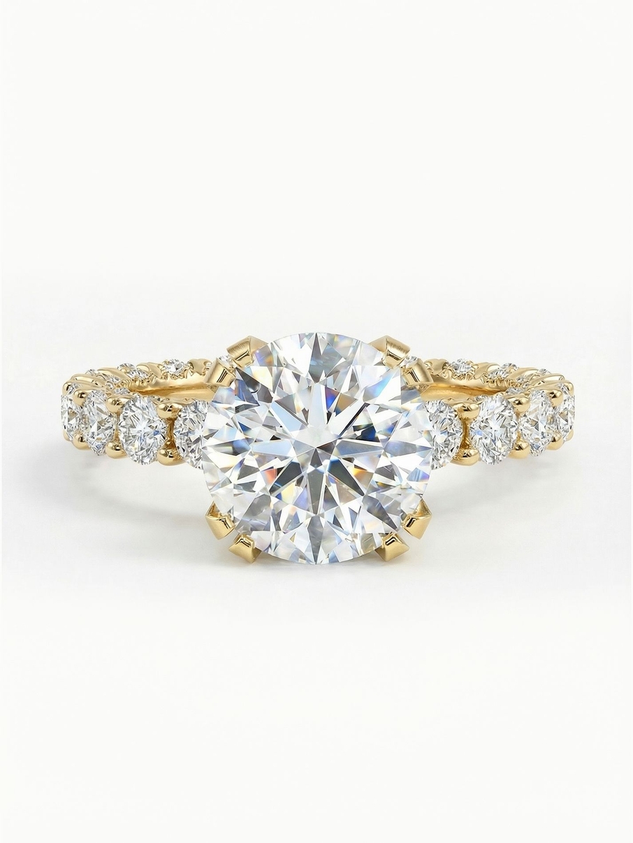 Statement yellow gold engagement ring with an 8 mm centre stone and smaller stones around the band