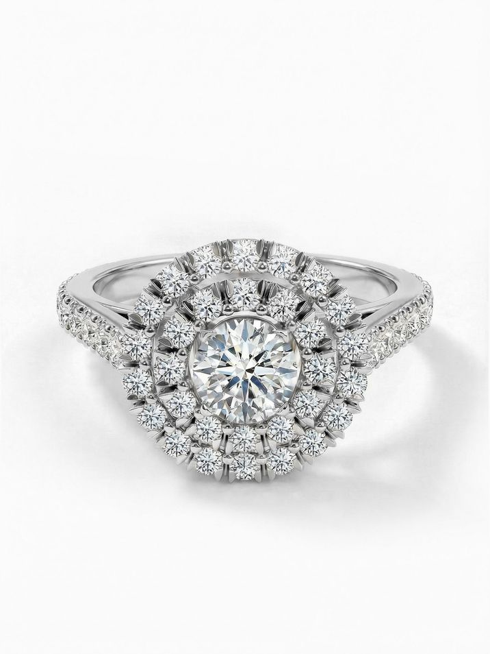 Striking white gold engagement ring with a 4.5 mm centre stone complemented by smaller stones