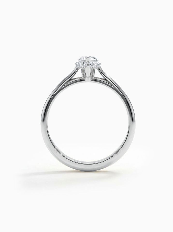 Zásnubný prsteň z bieleho zlata s minimalistickým dizajnom a žiarivým diamantom v bruse kvapky