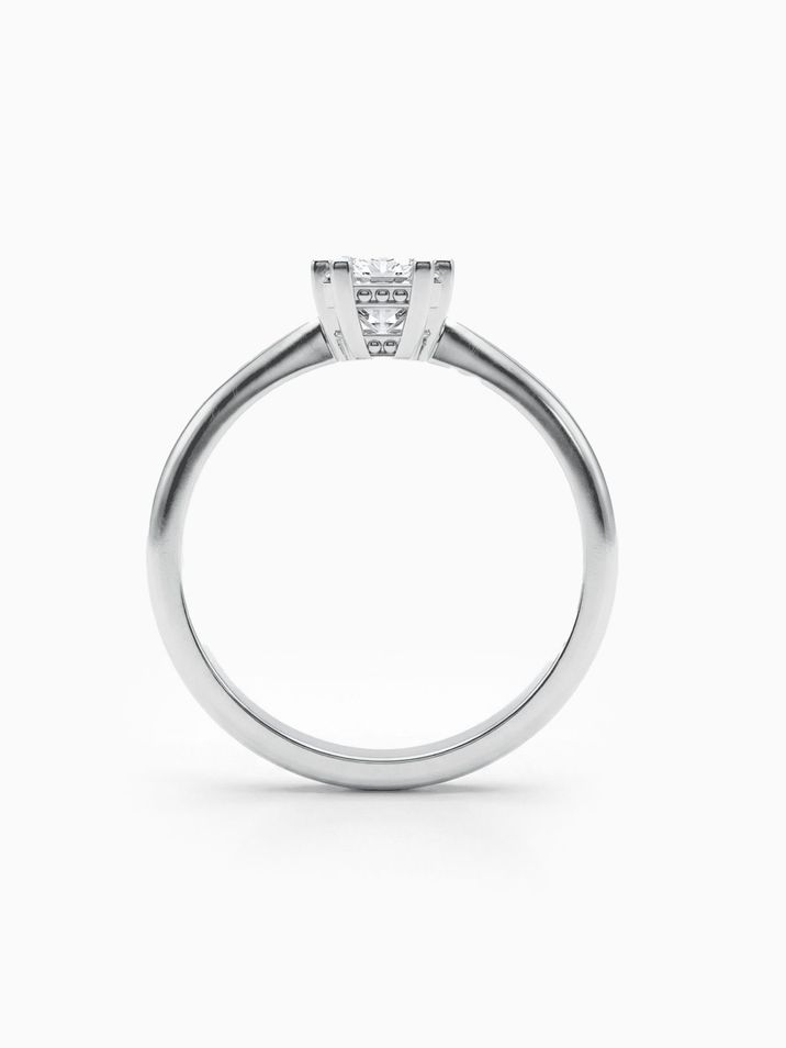 Elegant white gold engagement ring with a square princess-cut stone and a smooth band