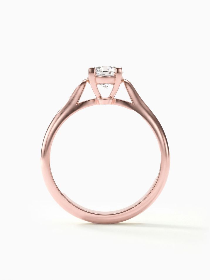 Rose gold engagement ring with a 5 mm centre stone sparkling in a high crown setting
