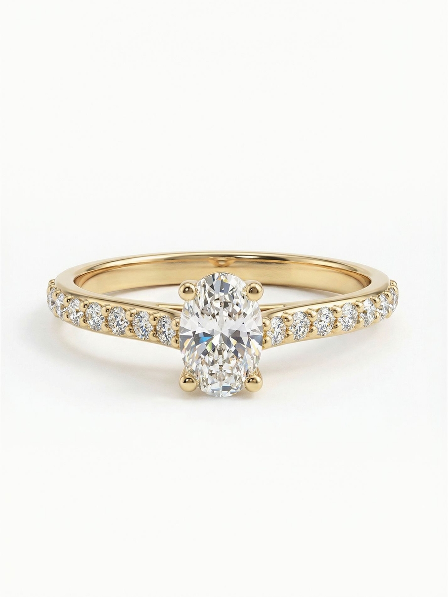 Engagement ring in yellow gold with an oval stone and fine accent stones for a luxurious look