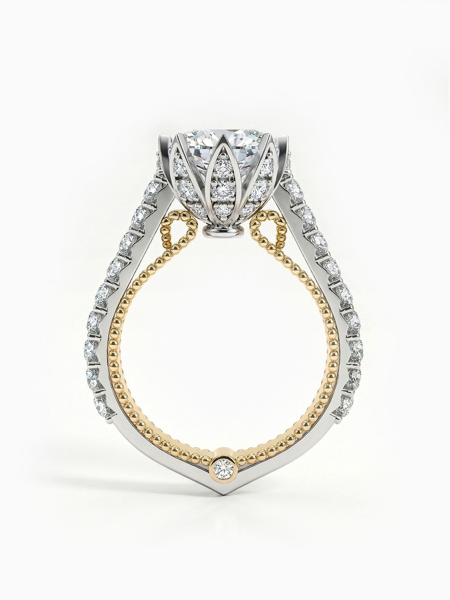 Gold engagement ring with a two-tone band, filigree and a set crown in a unique design