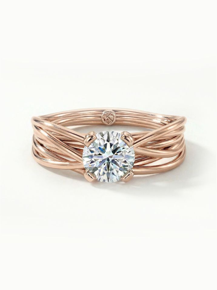 Rose gold engagement ring with a 6 mm centre stone, designed to resemble a nest of love