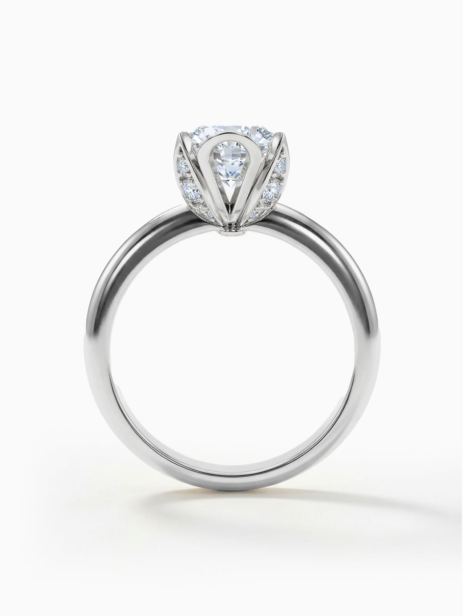 White gold engagement ring with a 5.5 mm centre stone set in a distinctive crown