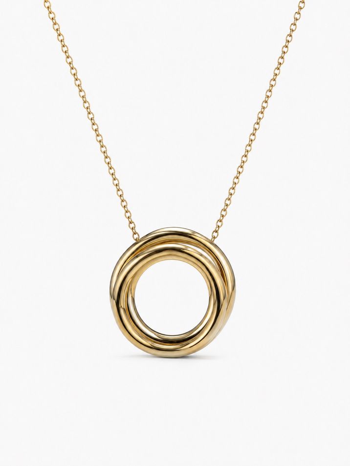 Náhrdelník ze žlutého zlata ve tvaru propleteného hnízda působí minimalisticky a zajímavě