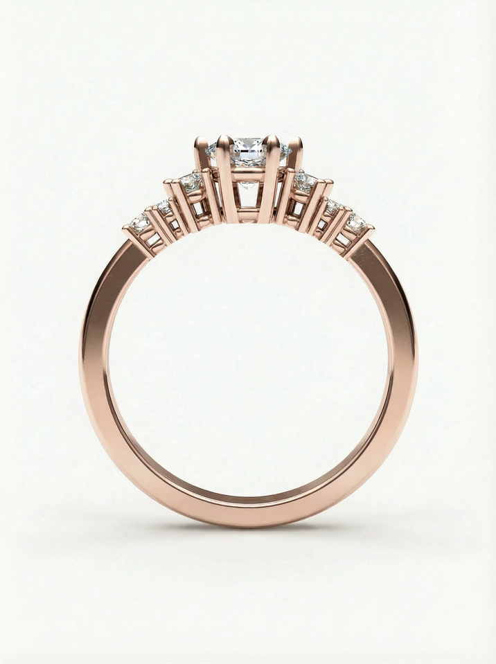 Rose gold engagement ring with a 4.5 mm centre stone surrounded by several smaller stones