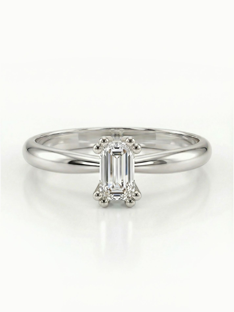 Sophisticated white gold engagement ring with an elongated-cut stone and a simple design