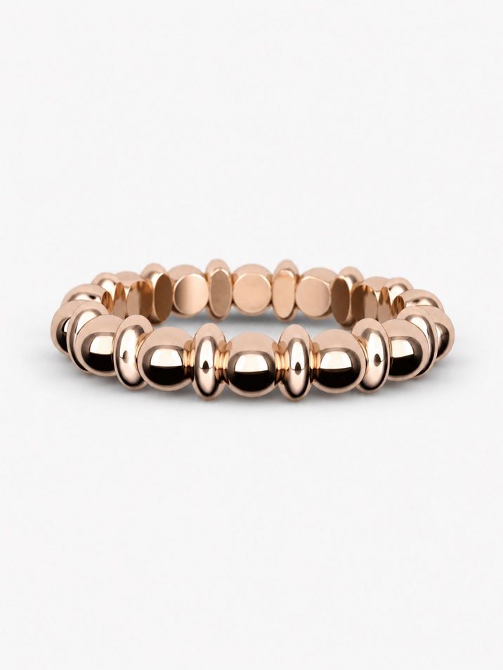A minimalist gold ring featuring delicate beads and ovals