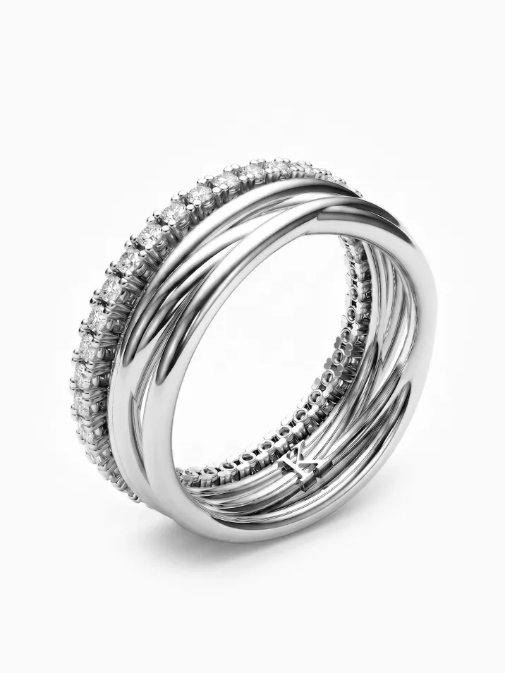 Atypický snubní prsten z bílého zlata pro milovníky designových šperků doplněný diamantovou řadou