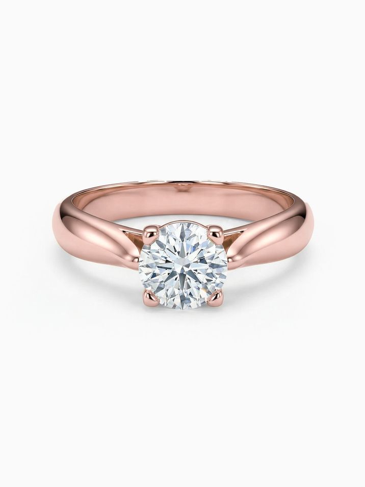 Rose gold engagement ring with a 5 mm centre stone sparkling in a high crown setting