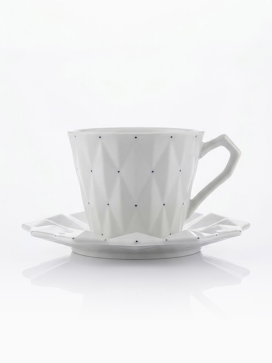 Porcelánový šálek s podšálkem Goldfinger