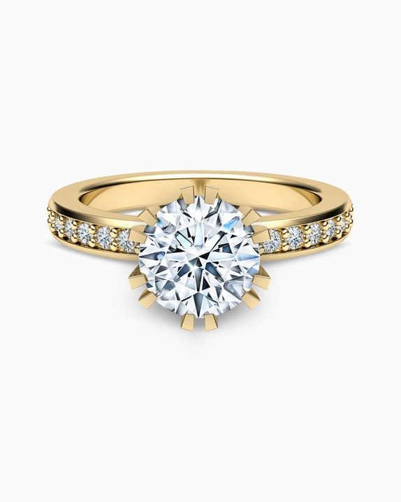 Zlatý prsten osázen diamanty a centrálním briliantem
