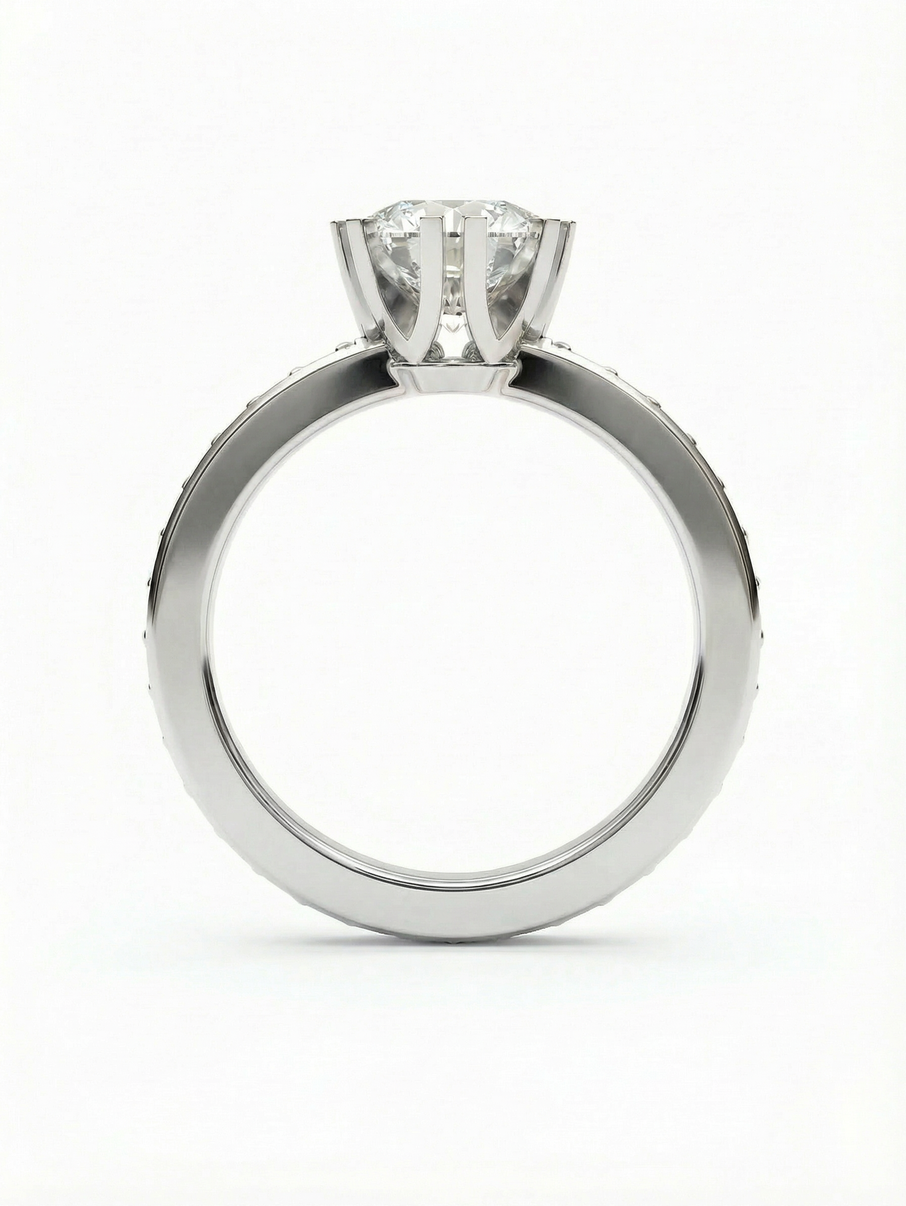 White gold engagement ring dominated by a 6 mm centre stone complemented by smaller stones