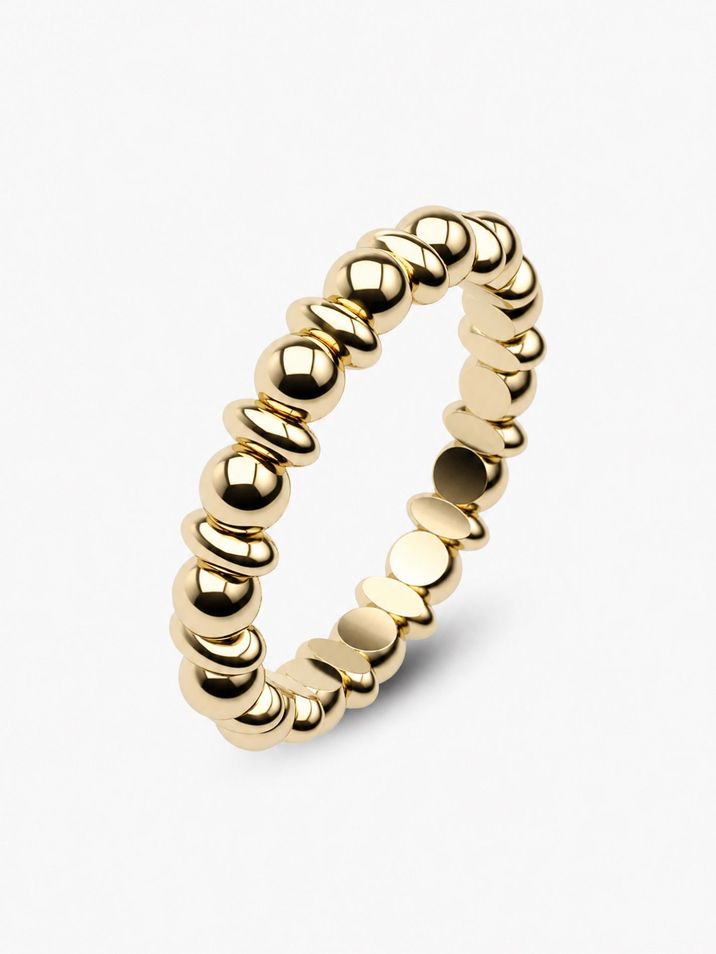 A minimalist gold ring featuring delicate beads and ovals