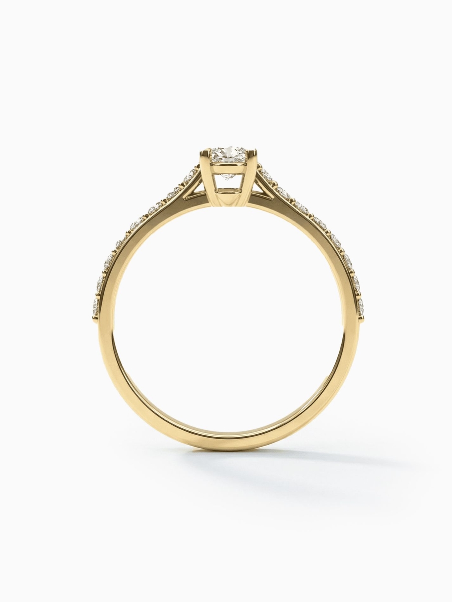 Engagement ring in yellow gold with an oval stone and fine accent stones for a luxurious look
