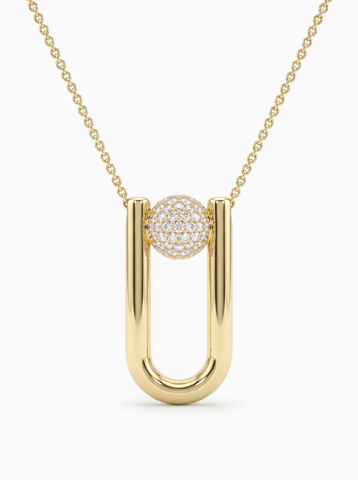 Design náhrdelníku ze žlutého zlata je unikátní diamantovým zdobením centrálního prvku ve tvaru kuli