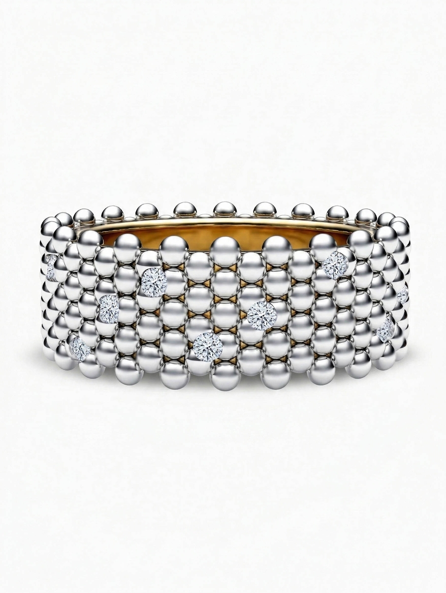 Široký snubní prsten bublinkového vzhledu z bílého a žlutého zlata doplněný drobnými diamany