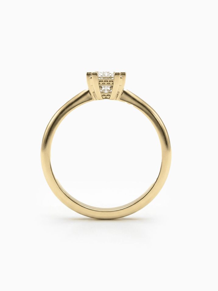Elegant yellow gold engagement ring with a square princess-cut stone and a smooth band